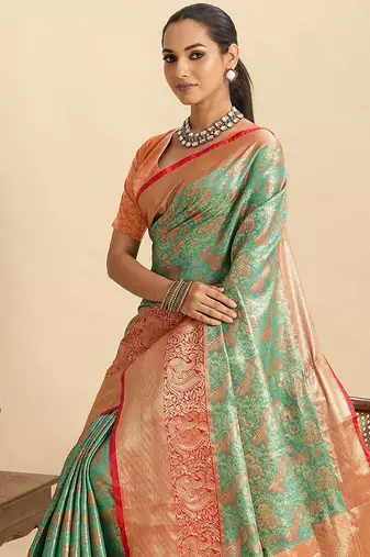 green art silk woven kanjivaram silk saree with blouses