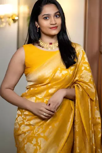 yellow silk blend banarasi saree with unstitched blouse piece
