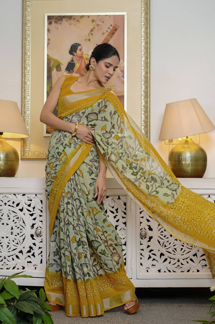green floral kalamkari  cotton blend saree with blouse piece