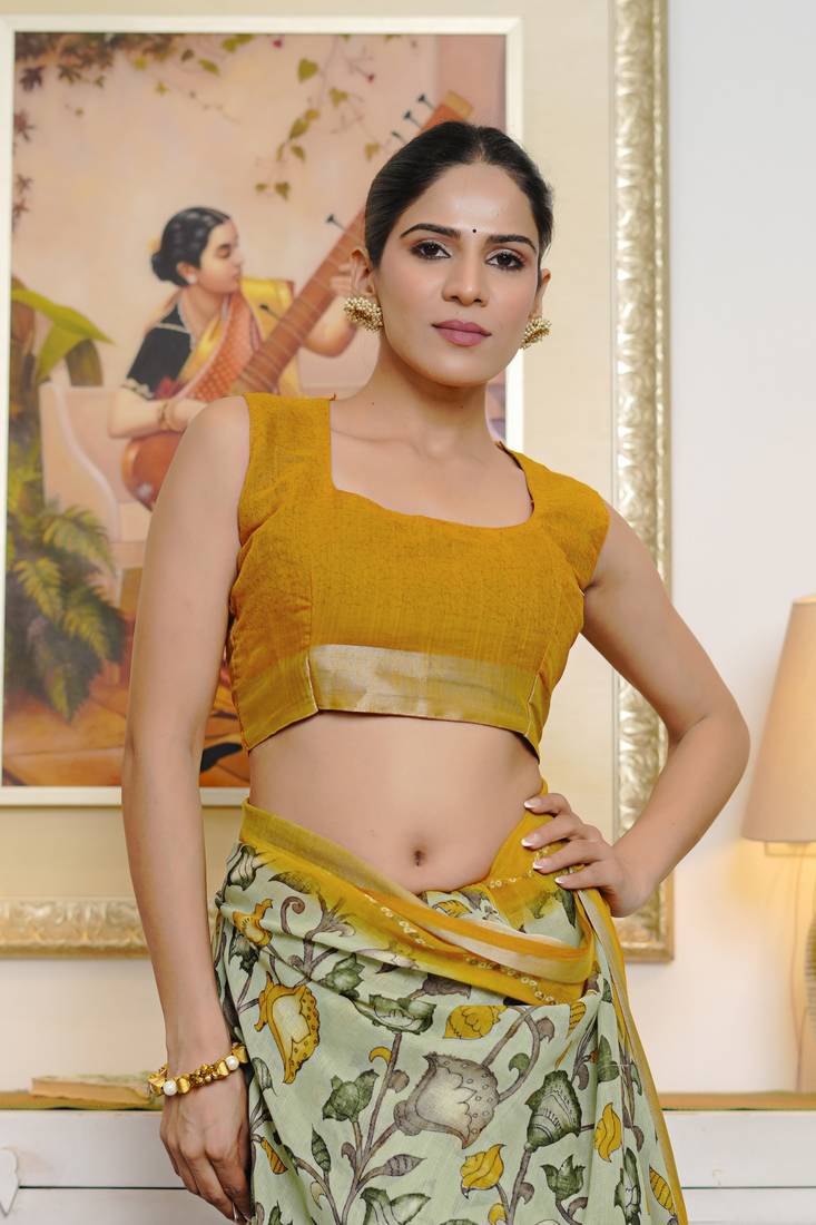 green floral kalamkari  cotton blend saree with blouse piece