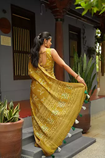 green geometric print cotton silk saree with blouse piece