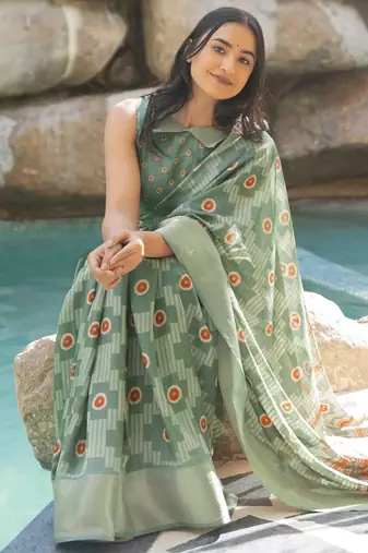 green geometric print cotton silk saree with blouse piece
