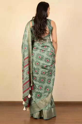 green geometric print cotton silk saree with blouse piece