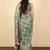 green geometric print cotton silk saree with blouse piece