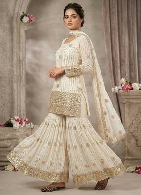 Premium white designer sharara set with heavy golden work 1