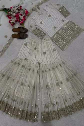 Premium white designer sharara set with heavy golden work