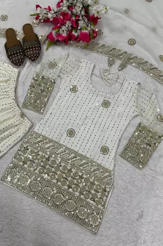 Premium white designer sharara set with heavy golden work