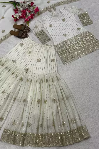 Premium white designer sharara set with heavy golden work