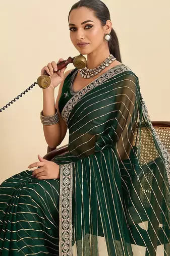 green georgette printed saree with blouse