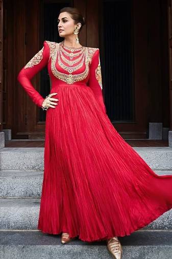 Red designer gown with gold embroidery
