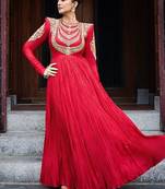 Red designer gown with gold embroidery