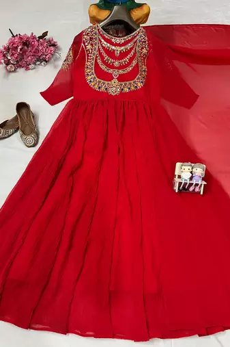 Red designer gown with gold embroidery