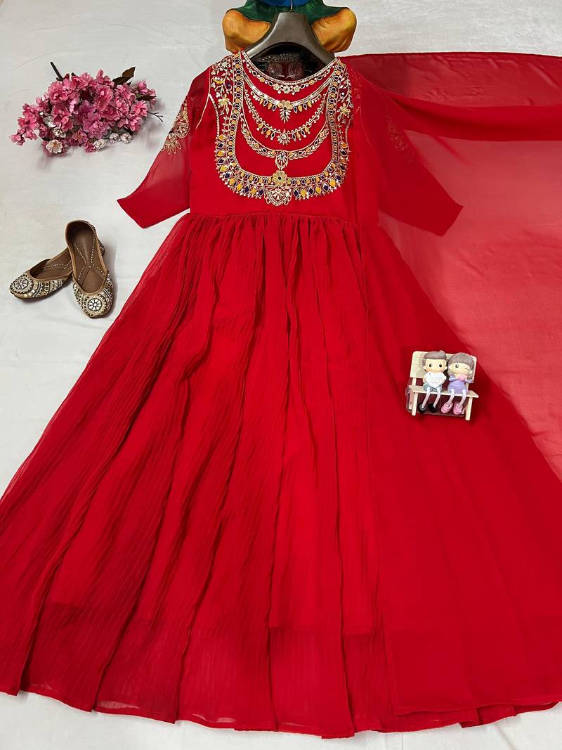 Red designer gown with gold embroidery