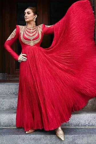 Red designer gown with gold embroidery