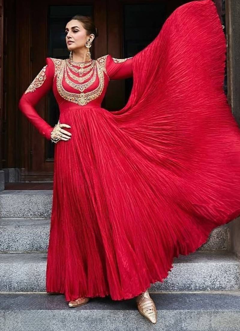 Red designer gown with gold embroidery