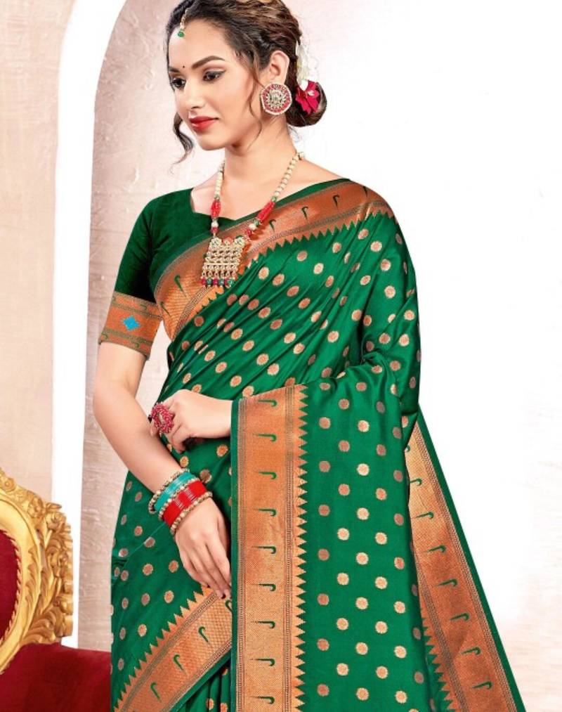 Emerald green silk blend saree with peacock motifs