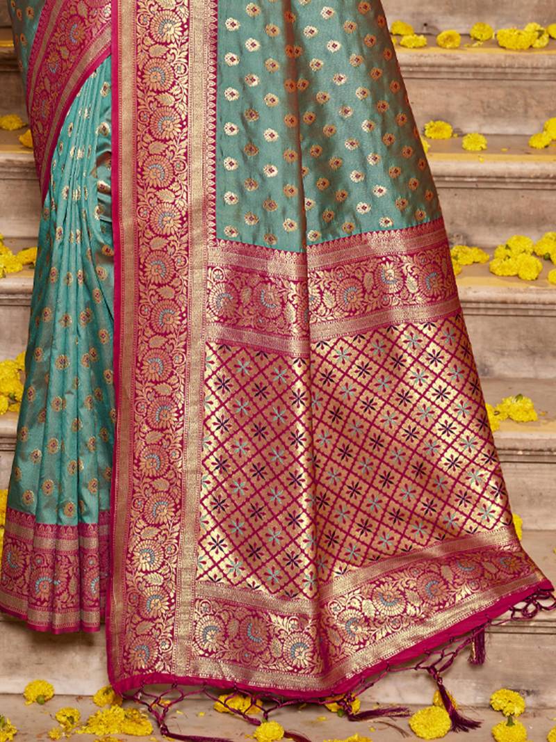 Teal green silk blend saree with magenta brocade