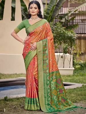 Vibrant orange and green patola-inspired silk blend saree 1