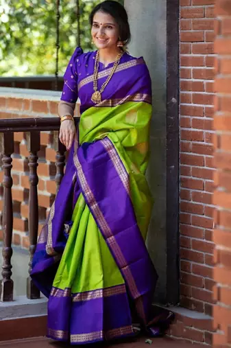 Vibrant green and deep purple silk blend saree with gold accents