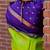 Vibrant green and deep purple silk blend saree with gold accents