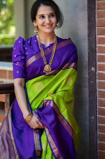 Vibrant green and deep purple silk blend saree with gold accents