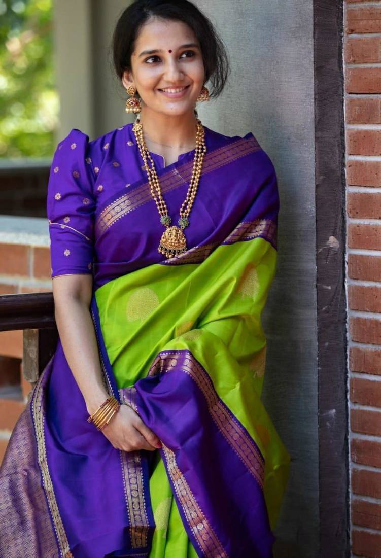 Vibrant green and deep purple silk blend saree with gold accents