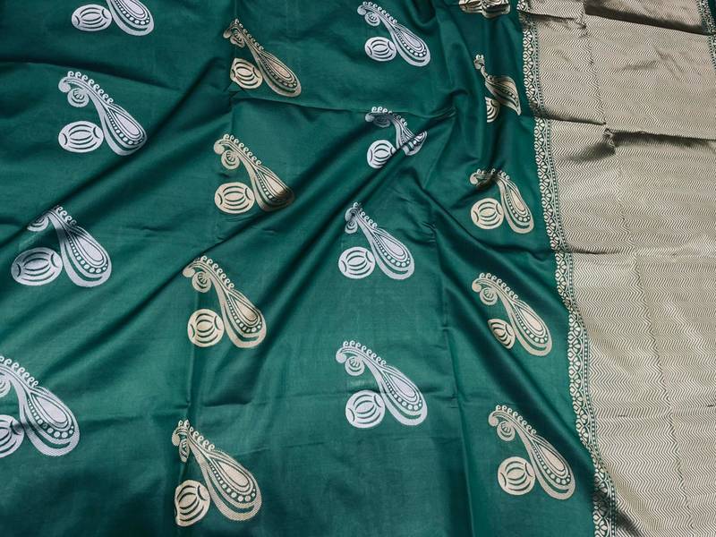 Deep forest green silk blend saree with gold zari paisley motifs