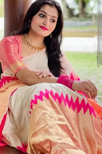 Cream off-white silk blend saree with striking pink and orange border