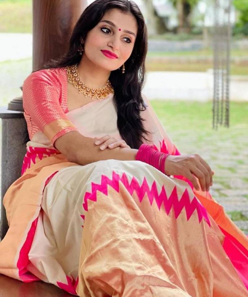 Cream off-white silk blend saree with striking pink and orange border