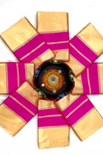 Cream off-white silk blend saree with striking pink and orange border