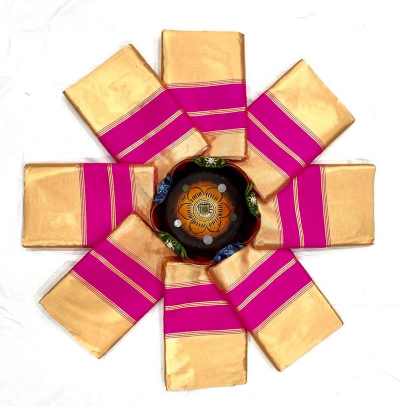 Cream off-white silk blend saree with striking pink and orange border