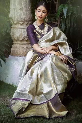 Luxurious silver cream silk blend saree with dark purple woven border
