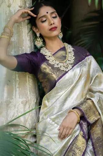 Luxurious silver cream silk blend saree with dark purple woven border