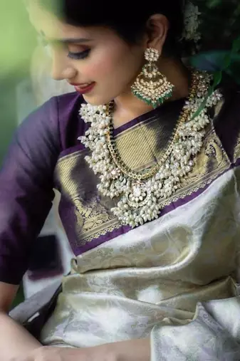 Luxurious silver cream silk blend saree with dark purple woven border