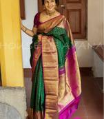Emerald green silk blend saree with magenta and gold ornate border