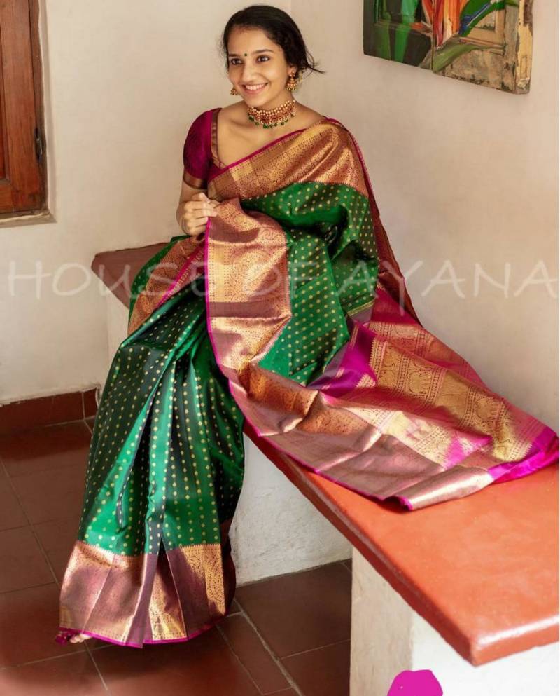 Emerald green silk blend saree with magenta and gold ornate border
