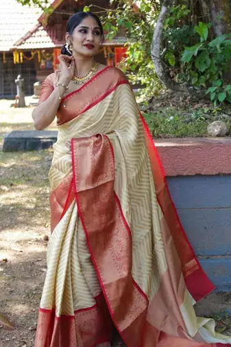 Elegant cream chevron silk blend saree with red border