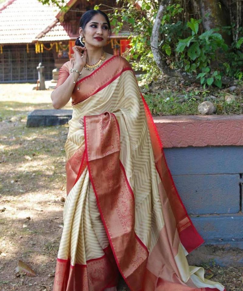 Elegant cream chevron silk blend saree with red border
