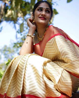 Elegant cream chevron silk blend saree with red border 4