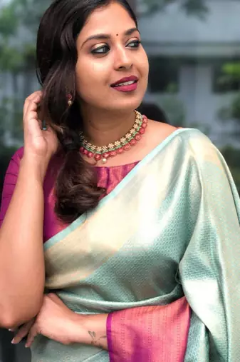 Mint green silk blend saree with vibrant magenta border