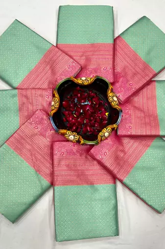 Mint green silk blend saree with vibrant magenta border