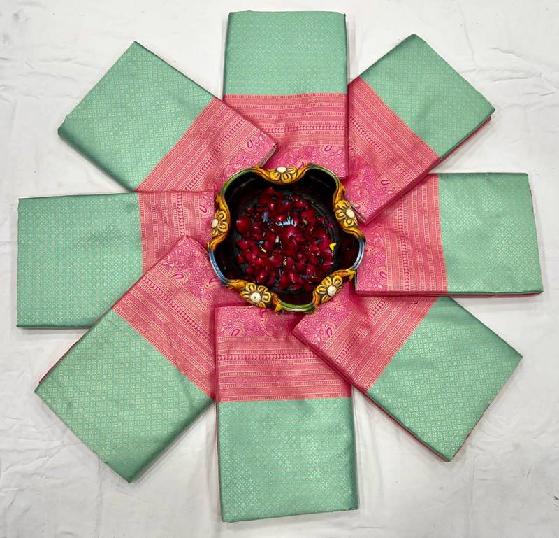 Mint green silk blend saree with vibrant magenta border