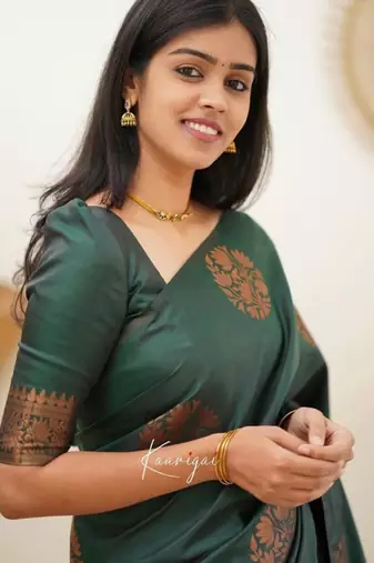 Deep teal silk blend saree with copper motifs