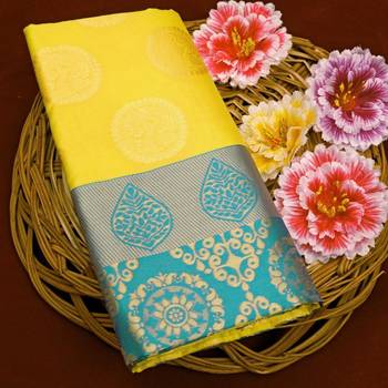 Radiant yellow silk blend saree with ornate teal border 5