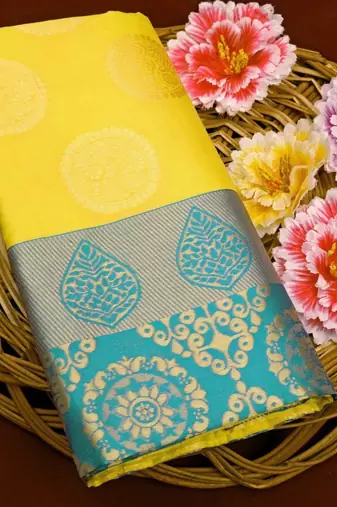 Radiant yellow silk blend saree with ornate teal border