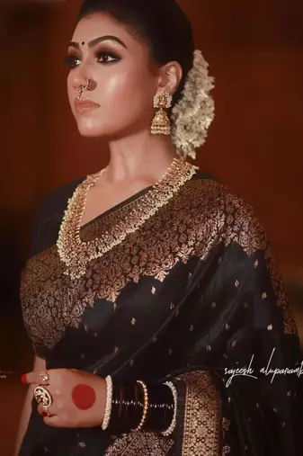 Elegant black silk blend saree with copper brocade work