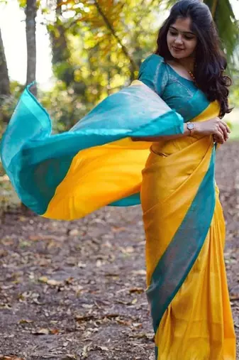 Vibrant mustard yellow and teal silk blend saree