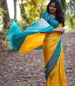 Vibrant mustard yellow and teal silk blend saree