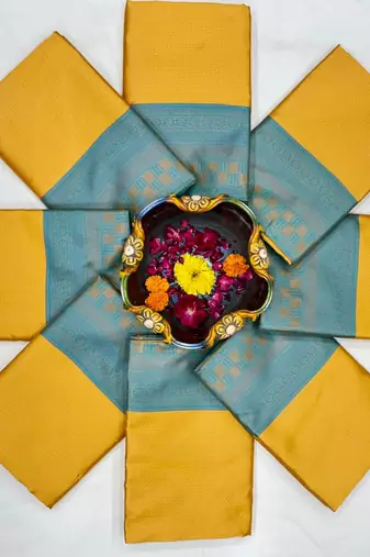 Vibrant mustard yellow and teal silk blend saree