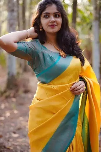 Vibrant mustard yellow and teal silk blend saree